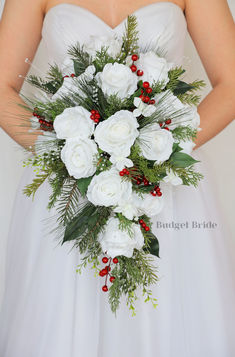 a bridal holding a bouquet of white flowers and greenery