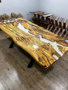 a wooden bench sitting on top of a hard wood floor