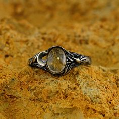 a close up of a ring on a rock