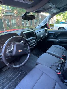 the interior of a vehicle with its dashboard and steering wheel