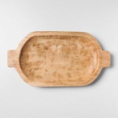 an empty wooden tray on a white background