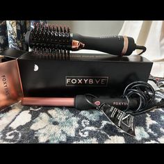 Foxybae Rose Gold Blowout Dryer Brush New & Foxy Bae Curling Wand. Foxy Bae Rose Gold Blow Dryer Brush And Curling Wand Combo New In Box, Never Used. Get Salon Results From Home With Our Rose Gold Blowout Brush. This All-In-1 Dryer Brush Detangles, Dries, And Styles Hair All In One Easy-To-Use Tool! The Ceramic-Coated Barrel Delivers Gorgeous Body And Shine All While Retaining Your Hair's Natural Moisture. Get The Salon Look Without The Price Tag, And Stay Frizz-Free And Foxy! Use Our Full Size Curly Blowout, Blowout Brush, Blow Dryer Brush, Dryer Brush, Blow Dry Brush, Curling Wand, Blow Dryer, Frizz Free, Wand Curls