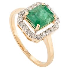 1.5 Carat Octagon Emerald Halo Diamond Engagement Ring in 18K Gold featuring natural emerald of 1.5 carats and diamonds of 0.27 carats. The gorgeous handcrafted ring goes with every style. Emerald enhances intellectual capacity of the person. Designed with octagon cut emerald in center with halo diamond that makes it a perfect fit to wear it on your wedding or style it with any of your basic outfit to give it a glam. This is a perfect May Birthstone Jewelry also perfect Emerald Diamond Ring. It can be a Bridal Shower Gift, Valentine Gift, Gift For Sister, Wedding Gift, Engagement Gift, Mother Daughter Gift, Bride To Be Gift, Mom Gift, Gift for Wife, BFF Gift, Best Friend Gift, Anniversary Present, Wife Gift, Girlfriend Gift or any Holiday Gift for Mother, Sister, Daughter, Grandma, Fiancé, Emerald Halo, Mother Daughter Gifts, Emerald Diamond Ring, Gold Gemstone Ring, May Birthstone, Bff Gifts, Handcrafted Rings, Halo Diamond Engagement Ring, Halo Engagement Ring