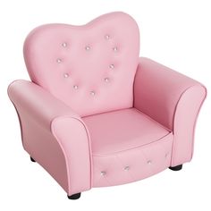 a pink children's chair with hearts on the armrests and diamond studding