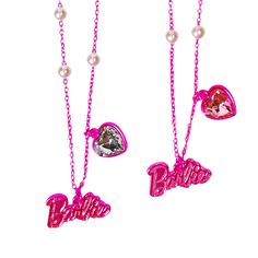 three pink necklaces with the word barbie written on them and heart shaped charms attached