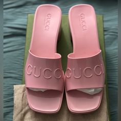 This Is An Authentic Pair Of Gucci Rubber Womens Gucci Logo Slide Sandal Size 38 In Pastel Pink. These Stylish Sandals Are Crafted Of Pink Rubber With The Gucci Logo Embossed On The Front Strap. Designer Id: 624730 Size: 38eu (Us 8) Heel: 2.25 In Platform: 0.75 In Comes With Box 2 Dust Bag Chic Gucci Flat Sandals, Gucci Flat Slides For Summer, Gucci Open Heel Spring Heels, Gucci Open Heel Heels For Spring, Designer Slides With Flat Heel For Summer, Designer Slides For Party, Designer Flat Heels For Summer, Gucci Summer Slides With Round Toe, Gucci Summer Sandals With Padded Heel