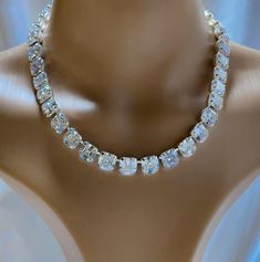 This is a beautiful Anna Wintour tennis necklace that looks like real Diamonds. These crystals are AAA vvs1 Asscher Cut 10 mm cubic zirconia. They sparkle and are intricately cut exactly like the gemstone. Absolutely Elegant. Matching earrings a lovely touch. https://www.etsy.com/shop/AmysFinery White Round Cut Crystal Tennis Necklace, White Cubic Zirconia Diamond Necklace Iced Out, White Diamond Necklace With Iced Out Cubic Zirconia, Iced Out White Cubic Zirconia Diamond Necklace, Dazzling Diamond White Crystal Tennis Necklace, Diamond White Crystal Tennis Necklace With Rhinestones, Wedding Tennis Necklace In Diamond White With Rhinestones, Diamond White Tennis Necklace With Rhinestones, Diamond White Tennis Necklace With Sparkling Cubic Zirconia