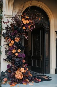 an entrance decorated with purple and orange flowers