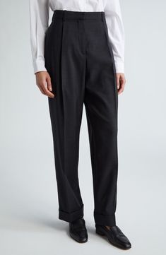 Pressed front creases add subtle structure to these lightweight wool trousers tailored in a slightly tapered wide-leg silhouette that ends with cuffed hems. 30 1/2" inseam; 20" leg opening; 11" front rise; 12 1/2" back rise (size 8) Zip fly with hook-and-bar closure Side-seam pockets; back welt pockets 100% wool Dry clean Made in Italy Designer Clothing Elegant Office Dress Pants With Tapered Leg, Classic Office Bottoms With Concealed Placket, Elegant Tapered Leg Office Dress Pants, Elegant Tapered Leg Dress Pants For Office, Tailored Wool Wide Leg Pants For Business Casual, Tailored Timeless Bottoms For Workwear, Timeless Wool Pants For Workwear, Wool High-waisted Dress Pants For Office, Classic Wool Bottoms For Work