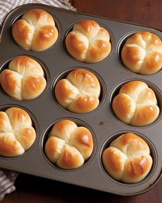 freshly baked hot cross buns in a muffin tin