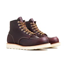 Red Wing's been making their Classic Moc boot for over 70 years. Its staying power is a testament to the shoe's quality and its timeless design. This release has an upper made from full-grain, waxed leather in a Black Cherry Excalibur color that will only improve over time. It's married to the Traction Tred rubber outsole with a Goodyear leather welt, allowing the boots to be resoled as needed. A cork midsole provides comfort while triple stitching and Taslan laces offer added durability, only i Goodyear Welt Moc Toe Boots In Vegetable Tanned Leather, Classic Waterproof Boots With Waxed Finish, Red Leather Waterproof Boots, Moc Toe Work Boots With Oiled Leather, Oiled Leather Work Boots With Moc Toe, Burgundy Plain Toe Boots With Leather Sole, Red Leather High-top Work Boots, Leather Waterproof Boots With Moc Toe And Waxed Finish, Leather Waterproof Boots With Waxed Finish And Moc Toe