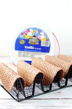 four pieces of bread sitting on top of a wire rack next to a container of yogurt