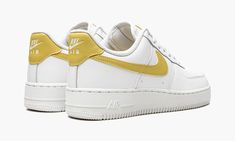 The Women’s Nike Air Force 1 Low “White/Saturn Gold” is a women’s-exclusive colorway of the classic basketball and lifestyle shoe that’s based on the popular “White on White” version, but with a twist.  Easily wearable thanks to its versatile color scheme, the Air Force 1 Low in “White/Saturn Gold” is an essential sneaker for the modern wardrobe.  The upper is constructed from white leather.  A Saturn Gold leather Swoosh is found on either side of the shoe.  The gold leather heel tab features wh Nike Gold, Nike Air Force 1 Low, Stadium Goods, Gold Shoes, Modern Wardrobe, Air Force 1 Low, Nike Cortez Sneaker, Gold Leather, Nike Air Force 1