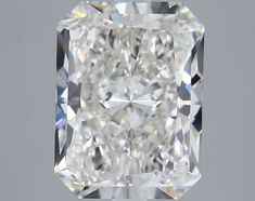 a cushion cut diamond on a gray background