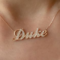 This unique personalized script font nameplate cut-out necklace is composed of 14K solid gold and beautifully pavé set with genuine GVs1 quality natural real Diamonds. This pendant is complemented by a durable 14K solid gold adjustable chain or can be purchased as a charm alone without the chain under the "Length" drop-down menu. NOTE: The item will be made in the exact casing of the characters entered. Please be mindful of this detail when providing the customization desired. Name Dimensions: a Personalized Rose Gold Diamond Necklaces, Rose Gold Hallmarked Name Necklace For Wedding, Luxury White Jewelry With Custom Name, Luxury White Custom Name Jewelry, Rose Gold Pendant Name Necklace In Fine Jewelry Style, Fine Jewelry Rose Gold Name Pendant Necklace, Fine Jewelry Rose Gold Pendant Name Necklace, Luxury Custom Name Rose Gold Jewelry, Luxury Rose Gold Custom Name Jewelry