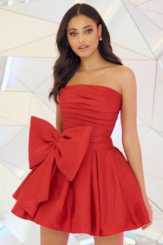 a woman in a short red dress with a big bow on the front and side