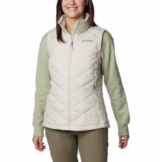 Whether you're walking in the woods or down the block, this Columbia women's vest keeps you cozy when the temps drop with synthetic insulation, a fleece-lined collar, and a thermal-reflective lining that warms your core. Walking In The Woods, Parka Vest, Lightweight Vest, Light Rain, Sweatshirt Short Sleeve, Chilly Weather, Clothes Women, Vest Shirt, Snow Jacket