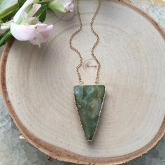 A gorgeous piece of pale green agate.  I love this pendant!!  Comes suspended on a gold plated chain.  I think it looks best on a long 30" or 35" chain!  But you could totally wear this on a shorter chain too!  - Electroplated Agate Triangle- 14k Gold Plated ChainYou will receive the exact pendant shown!Select your desired length at check out. If you want a length that is not listed just send me a message.This necklace is custom made to your preferences and will be ready to ship within 3-5 days. Gold Chalcedony Jewelry As A Gift, Gold Jade Gemstone Crystal Necklace, Gold Jade Crystal Necklace With Gemstone, Bohemian Gold Jewelry With Moss Agate, Gold Jewelry With Natural Moss Agate Stones, Gold Necklaces With Natural Stones And Chalcedony, Gold Necklaces With Natural Stones In Chalcedony, Gold Jade Crystal Necklace As Gift, Gold Chalcedony Necklace With Natural Stones