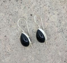 Black Onyx Teardrop Earrings * Sterling Silver Black Onyx Earrings * Pear Black Onyx Earrings For Womens * Dainty Gemstone Earrings For Gift Gemstone:- Black Onyx Gemstone Shape:-Pear Gemstone Size:- 10 mm x 14 mm Material:- Solid 925 Sterling Silver Dimension :-0.4 Inch wide x 1.14 Inch long with Hook Weight :- 4 gm                                                                     FAQ                                     **Q. What is solid silver 92.5** A. Solid silver 92.5 is precious silver metal contained 92.5% pure precious silver metal.                 **Q. Are the stoned used in Jewelry are natural gem stones.** A. Yes it means NATURAL SEMI PRECIOUS GEM STONES.                    ** Q. The product displayed/sold  are unused brand new Merchandise.** A. Yes the product displayed/sold Nickel Free Black Teardrop Jewelry, Nickel-free Black Teardrop Jewelry, Black Drop Jewelry With Pierced Details, Black Teardrop Jewelry With Matching Earrings, Black Drop-shaped Pierced Jewelry, Black Nickel-free Teardrop Jewelry, Nickel-free Black Long Drop Jewelry, Black Teardrop Pierced Jewelry, Pierced Black Teardrop Jewelry