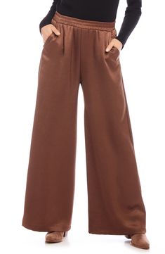 A versatile solid hue brings chic appeal to these flowy wide-leg pants crafted with a comfortable elastic waist. 29" inseam; 29" leg opening; 13" front rise; 16" back rise (size Medium) Pull-on style Front slant pockets 55% polyester, 45% recycled polyester Dry clean Made in the USA of imported fabric Elegant Wide Leg Sweatpants, Fall Ankle-length Wide Leg Pants, Solid Wide Leg Full Length Pants For Fall, Versatile Wide Leg Sweatpants For Fall, Solid Color Full Length Wide Leg Pants For Fall, Brown Sweatpants For Fall, Fall Wide Leg Pants With Relaxed Fit, Wide-leg Sweatpants With Elastic Waistband For Fall, Chic Full-length Sweatpants For Fall