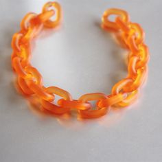 Matte orange acrylic oval chain links, acrylic chain links,  open link. ※ Description ※ ♥ Size: per link 19mmx14mm, thickness of 4.5mm. ♥ Color: matte orange ♥ Qty: 60pcs ♥ Useage: diy for bracelet, necklace or other craft items. ♥ Package: well poly bag and wrapped by package material to prevent breakage and wearout. ※ Shipping Time ※ Shipping time: The delivery time is around 9-30 working days.Sometimes the arriving time is possibly postponed.If that, Pls kindly understand. ※ Customer Service ※  ♥About the product, shipping,bulk order discount, customized matters pls feel free to contact us, we will apply ourselves to optimize your shopping experience. Trendy Orange Plastic Jewelry, Plastic Necklace, Chain Links, Packaging Material, Poly Bags, Craft Items, Necklace Chain, Chain Link, Chains Necklace