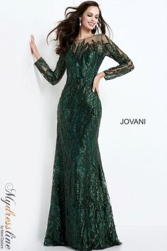 a woman in a long green dress posing for the camera