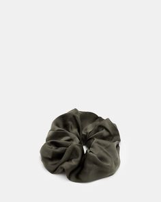 Meet our scrunchies. This is the Tar. It's been made using off-cut materials usually found on our new-season shirts and dresses. Part of an ongoing conscious initiative, this everyday accessory avoids textile waste.  Oversized Made from off-cut fabrics Saint Coloring, Oversized Scrunchie, Textile Waste, Embellished Headbands, Everyday Accessories, And Dresses, Green Hair, All Saints, Scrunchies