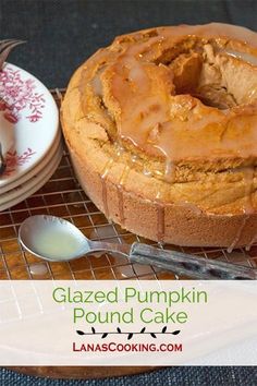 baked pumpkin pound cake on cooling rack with spoon and plate next to it, text glazed pumpkin pound cake