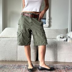 Vintage y2k khaki green cargo shorts low rise short cargo pocket shorts. Model is 32D/26 waist/5ft. Measures 34 inches waist by 11 inches inseam. Tagged size 32W. Y2k Green Cargo Pants For Streetwear, Y2k Style Green Cargo Pants For Streetwear, Green Y2k Cargo Pants For Streetwear, Y2k Cargo Style Khaki Bottoms, Y2k Khaki Bottoms With Cargo Pockets, Y2k Khaki Cargo Bottoms, Y2k Style Khaki Cargo Bottoms, Y2k Green Cargo Style Bottoms, Green Y2k Style Cargo Bottoms