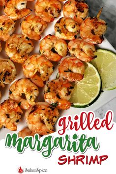 grilled margarita shrimp on a platter with lime wedges