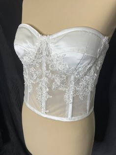 Ivory corset with delicate lace.   Lace up back. Sizing is the same as your strapless dress size. Elegant Bandeau Corset Dress With Boned Bodice, Elegant Lace Corset Dress With Corset Back, Elegant Lace Corset Back Dress, Fitted Lace Corset Dress With Lace Back, Elegant Bandeau Corset Dress, Elegant Bandeau Corset With Fitted Bodice, Elegant Strapless Corset For Prom, Lace Fitted Corset For Prom, Lace Overbust Corset With Lace Bodice