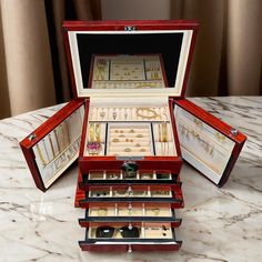 an open jewelry box on a marble table