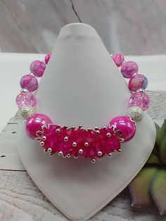 "Handmade and designed by me-fuchsia glass crystal beads-various glass beads-silver tone beads-fits a 7 \" wrist-silver tone-lobster clasp-1\" extender chain-this bracelet makes a great gift for your relatives or reward yourself" Adjustable Beaded Glass Crystal Bracelet, Glass Bracelets With Faceted Beads, Pink Crystal Bracelet With 8mm Beads For Party, Adjustable Pink Crystal Bracelet With Faceted Beads, Adjustable Glass Crystal Bracelet With Faceted Beads, Pink Crystal Bracelets With Round Beads, Party Beaded Glass Crystal Bracelet, Pink Large Beads Bracelet For Party, Pink Crystal Beaded Bracelets With Round Beads