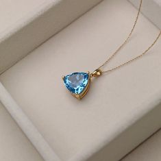 A T T R I B U T E S Vintage ∙ Solid Gold ∙ Estate Jewelry ∙ November Birthstone D E T A I L S ~ Vintage Necklace ~ 14K Yellow Gold ~ Sky Blue Topaz  ~ Trillion Cut aka fat triangle :) ~ Hallmarked ~ Gold Stamped ~ Velvet jewelry travel pouch and gift box included ~ Shipping, full insurance and signature confirmation included S P E C S Pendant Length: approx. 0.72" with bale Pendant Width (at widest point): 0.5" Shorter Necklace ~ Total Weight: 3.6g ~ Length: 18" chain Longer Necklace ~ Weight: 3 Blue Topaz Gemstones For Gifts, Sapphire Gemstones Fine Jewelry Gift, Sapphire Gemstones For Gifts, Fine Jewelry, Classic Blue Topaz Necklace For Gift, Luxury Blue Topaz Birthstone Jewelry, Luxury Trillion Cut Jewelry For Gifts, Luxury Trillion Cut Jewelry Gift, Fine Jewelry Blue Topaz For Gift, Fine Jewelry Blue Topaz Gift