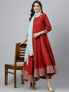 Size & Fit Sizes: To Fit Bust (in inches): S(34), M(36), L(38), XL(40), 2XL(42), 3XL(44) Length: 50 inches PRODUCT DETAILS Consists of a kurta and dupatta Kurta Color: maroon Dupatta color: Blue Solid Round neck Three-quarter, regular sleeves Anarkali shape with angrakha style Ankle length with flared hem Material & Care Viscose Rayon Hand-wash Complete The Look You'll love the elegant design and fit of this stunning dress from Vitans. Dress up for your next family event by pairing this piece wi Maroon Dupatta, Kurti With Dupatta, Kurta And Dupatta, Angrakha Style, Anarkali Kurti, Family Event, Viscose Rayon, Anarkali Dress, Blue Solid