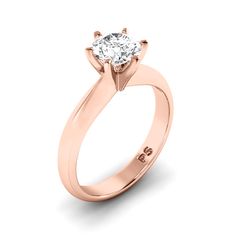 a rose gold engagement ring with a single diamond