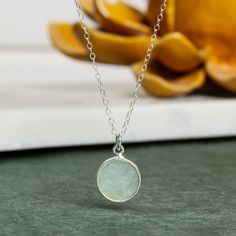 Handmade Gemstone Necklace - Aquamarine 925 Sterling Silver Round Disc Pendant Dainty Cable Chain - Jewelry Gifts for Mom, wife, sister, bff Stone: Genuine Aquamarine Please note due to nature of our genuine stones no two are alike and the ones you will receive will vary slightly from the ones pictured in the photos. Bezel: 925 Sterling Silver. Bezel only goes around the gemstone. Both back and front show the stone. Chain: 925 Sterling Silver, 16 to 8 inch adjustable, 1.3mm cable, Spring Ring Cl Sterling Silver Charm Necklace With Round Natural Stone Pendant, Dainty Silver Necklace With Natural Stones, Silver Charm Necklace With Round Natural Stone Pendant, Moonstone Round Pendant Jewelry For Gift, Delicate Sterling Silver Necklace For May Birthstone, Delicate Silver Necklace With May Birthstone, Delicate Silver Necklace For May Birthstone, Gemstone Charm Necklace With Round Pendant For Her, Gemstone Round Pendant Charm Necklace For Her