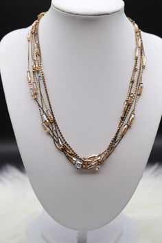 Long Metal Necklace With Jewels, Long Metal Chain Necklace With Jewels, Long Jewel Metal Chain Necklace, Long Jeweled Metal Chain Necklace, Elegant Multi-strand Crystal Necklace For Gift, Elegant Long Necklace With Rhinestones, Elegant Long Rhinestone Necklace, Elegant Double Strand Metal Layered Necklace, Dazzling Gold Rhinestone Necklace