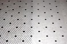 two black and white hexagonal tiles with dots on one side, the other half