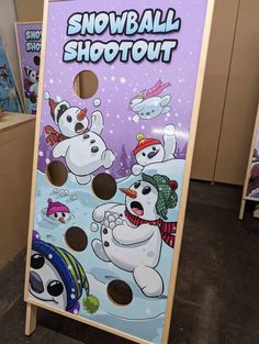 a snowball shooter game in the middle of a room with other games on it