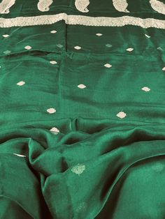 SILK MARK CERTIFIED !!! Gorgeous Pure Chiffon Silk Saree in Bottle Green Color with Sliver Zari Work. Item : SareeBase Fabric : Pure Chiffon Color : Bottle Green Blouse piece : Comes with un-stitched Blouse piece.Blouse material : Pure ChiffonFall & Edging(Yes/No) : YesSilk Mark Certificate given with the Saree(Yes/No) : YesDisclaimer -:- Color variation is possible due to various reasons like phone or desktop setting, resolution etc. Please don't hold us responsible. Our aim is to put the exact Bottle Green Blouse, Sarees Silk, Pure Chiffon, On The Border, Readymade Blouse, Zari Work, Blouse Material, Bottle Green, Party Wear Sarees