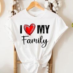 I Love My Family T Shirt, Relatives Party Families Reunion T-Shirts This Tee Shirt Is Absolutely Brand New, Complete With Tags Still Securely Attached. It Remains Untouched And Is Accessible In A Wide Range Of Sizes, Catering To Both Men And Women, From S To 3xl. These Tees Boast An Exceptional Level Of Softness, Offering A Comfortable, Relaxed Fit For Women And A Classic Fit For Men. To Ensure They Retain Their Top-Notch Quality, It Is Strongly Recommended To Launder Them With Cold Water. Addit Casual White Tops For Family Events, Fun Letter Print Tops For Family Occasions, Family Reunion Graphic Tee With Text Print, Family Summer T-shirt With Name Print, Graphic Tee T-shirt With Text Print For Family Reunion, Graphic Tee With Text Print For Family Reunion, White Slogan Top For Mother's Day, White Graphic Tee For Family Events, White Graphic Tee For Family