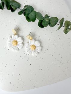 These white daisy earrings add the perfect floral statement to your spring outfits! Floral details are sculpted individually by hand in small batches. Shop the rest of the floral collection here: https://www.etsy.com/shop/PaintedLeafStudioCo?section_id=47823729 Earrings measure approximately 1.75 inches in length and 1.25 inches in width and are lightweight. Hand sculpted polymer clay earrings, crafted delicately and finished with attention to detail. Hypoallergenic nickel-free posts, hoops, hoo Floral Clay Earrings, Outfits Floral, Floral Collection, Daisy Earrings, White Daisy, Earrings White, Spring Flower, Earrings Statement, Floral Earrings