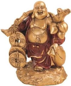 a statue of a laughing buddha holding two gold coins and an animal figurine