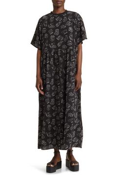 This soft T-shirt maxi is crafted in an oversized silhouette with an allover print and elbow-length sleeves. Crewneck Elbow-length sleeves Lined 100% polyester Hand wash, line dry Imported Oversized Cotton Casual Maxi Dress, Oversized Casual Maxi Dress For Daywear, Casual Oversized Maxi Dress For Daywear, Casual Graphic Print Maxi Dress For Spring, Spring Casual Maxi Dress With Graphic Print, Casual Graphic Print Loungewear Dress, Printed Short Sleeve Loungewear Dress, Casual Spring Maxi Dress With Graphic Print, Oversized Printed Black Dresses