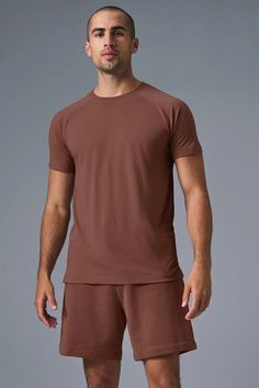 The Triumph Crew Neck Tee - Chestnut | Alo Yoga Sporty Brown Short Sleeve T-shirt, Versatile Crew Neck Sports T-shirt, Casual Solid Color Alo Yoga Activewear, Casual Alo Yoga Tops For Loungewear, Alo Yoga Casual Solid Color Activewear, Alo Yoga Casual Loungewear Top, Casual Crew Neck T-shirt With Go-dry Technology, Relaxed Fit Short Sleeve T-shirt With Go-dry, Casual Go-dry Crew Neck T-shirt