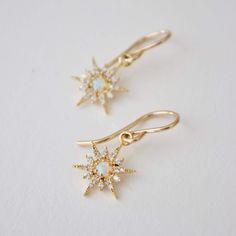 Opal starburst earrings Gold-filled simple earwires 16kt gold plate synthetic opal star earrings Elegant Star-shaped Jewelry With Ear Wire, Elegant Star-shaped 14k Gold Filled Jewelry, Elegant 14k Gold Filled Star Jewelry, Celestial Drop Earrings With Star Charm, Celestial Drop Earrings For Everyday, Everyday Celestial Drop Earrings, Dainty Star Shaped Nickel Free Jewelry, Celestial 14k Gold Filled Drop Earrings, 14k Gold Filled Star-shaped Yellow Gold Jewelry