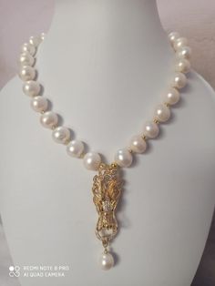 23'' 626 Carat AAA Quality Natural Fresh Water Pearl round Pearls Baroque Pearl With gold Plated Pendent Gemstone Necklace with earring Stone :Natural Fresh Water Pearl Shape : round Size :-13*13- 15*15mm Weight :- 626 carat length - 23 inch Pendent - gold Plated Polish :- Handmade Purity :- 100% Natural Gemstone color - white (If you want maximum or minimum quantity of this size other than listed, let me know, i will list/provide it to you in wholesale price.) Click below to see live stock: htt Luxury Baroque Pearl Charm Jewelry, Luxury Pearl Necklace With Round Gemstone Beads, Gold Gemstone Necklaces With Baroque Pearls, Exquisite Pearl White Round Necklace, Antique Pearl Pendant Necklace, Gold Baroque Single Strand Necklace, Luxury Pearl Necklace With Lobster Clasp As Gift, Baroque Pearl Pendant Necklace For Formal Occasions, Luxury Yellow Gold Baroque Necklace