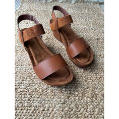 Discover The Perfect Blend Of Style And Comfort With The Pierre Dumas Wedge Sandal. Crafted From Faux Leather In A Rich Brown Hue, This Sandal Features A Mid-Height Wedge Heel 2.5” That Offers Just The Right Amount Of Lift. The Woven Design Adds A Touch Of Elegance, While The Adjustable Strap And Peep Toe Ensure A Secure And Breathable Fit. Ideal For Casual Summer Outings, These Sandals Are Perfect For Brunch Dates, Beach Walks, Or Weekend Getaways. New In Box. Keywords: Pierre Dumas, Wedge Sand Blue Low Heels, Brown Wedge Heels, Low Block Heel Sandal, Sparkly Sandals, Brunch Dates, Beach Walks, Brown Wedges, Metallic Sandals, Studded Sandals