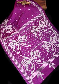 This Purple Authentic Butterfly Theme Hand Kantha Embroidery Art Silk Saree is absolutely enchanting! Imagine delicate butterflies, with their wings outstretched in flight, intricately embroidered by hand on luxurious art silk fabric. The symbolism of butterflies - representing transformation, beauty, and freedom - adds a poetic touch to the saree. Each butterfly motif, meticulously stitched using the Kantha embroidery technique, would capture the graceful movement and intricate details of these Purple Saree With Intricate Embroidery For Festivals, Bohemian Purple Embroidered Traditional Wear, Traditional Silk Fabric With Intricate Embroidery, Purple Embroidered Art Silk Saree, Purple Saree With Intricate Embroidery, White Silk Embroidered Fabric With Motifs, Festive Purple Saree With Woven Motifs, Purple Intricately Embroidered Fabric For Festivals, Unstitched Purple Embroidered Saree Fabric